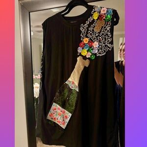QUEEN OF SPARKLES Black Mini Dress with Colorful Floral and Champagne Design